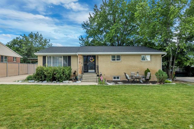 1215 8th Street Ogden, UT 84404 - Photo 2 of 39 Single-story residence featuring a brick exterior with a dark roof and prominent front steps