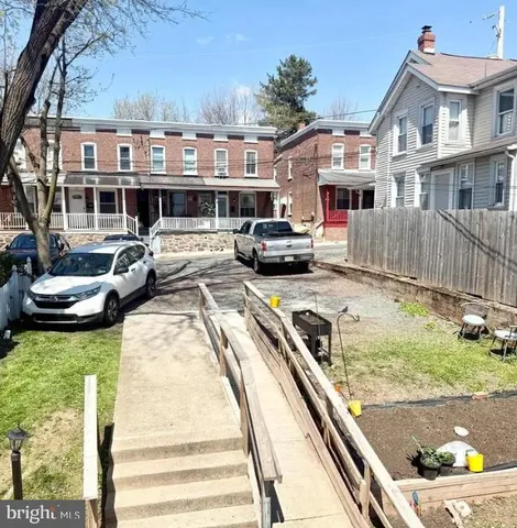 a view of a big yard with potted plants
