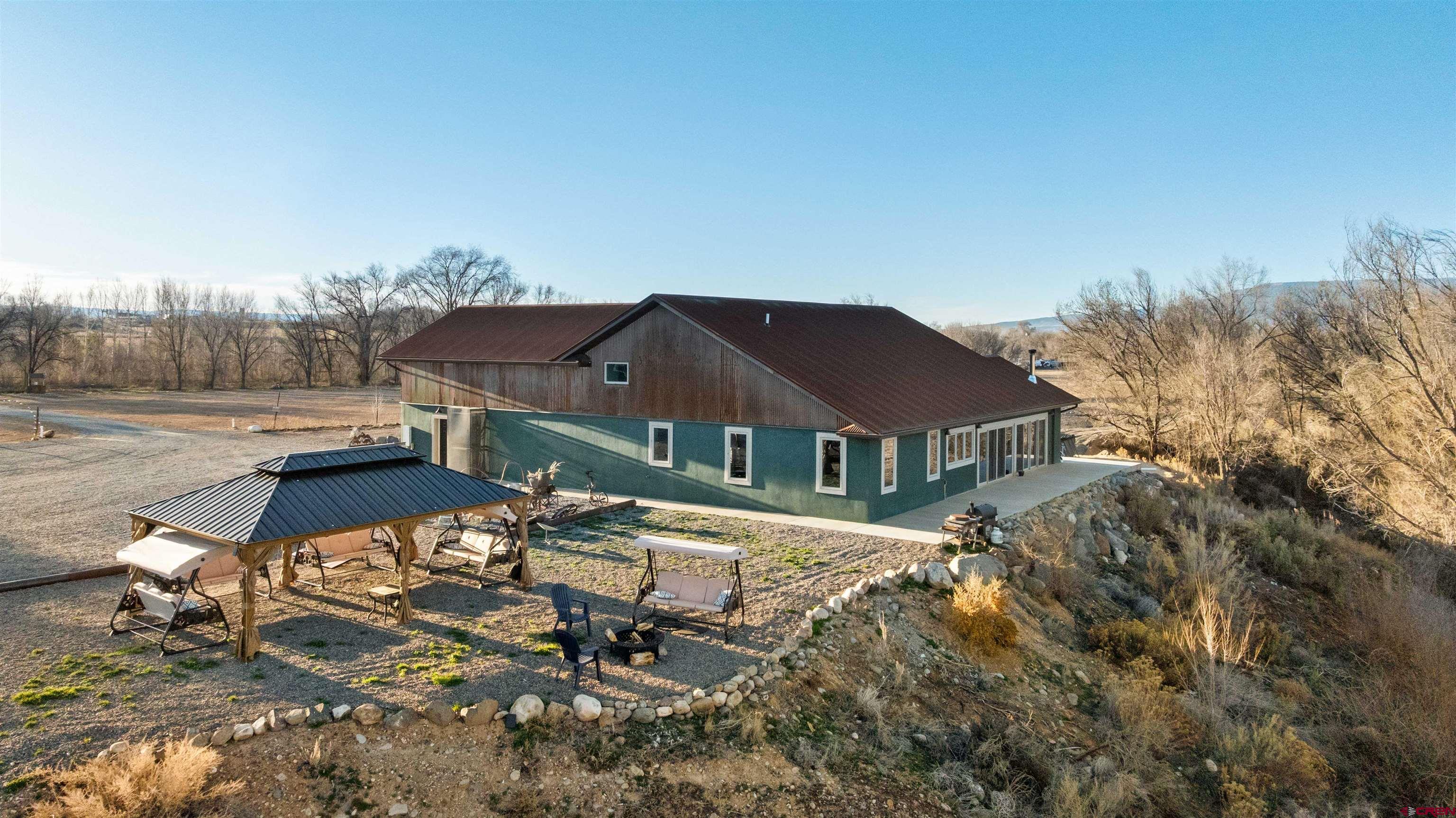 55347 Begonia Road Delta, CO 81416 - Photo 6 of 44 a view of a house with a yard