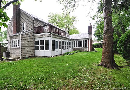 171 East Rockaway Road Hewlett, NY 11557 - Photo 13 of 13 a view of a house with a yard