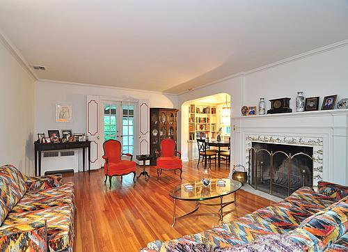 171 East Rockaway Road Hewlett, NY 11557 - Photo 2 of 13 a living room with furniture and a fireplace