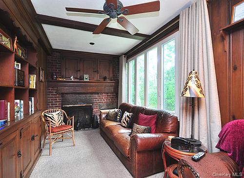 171 East Rockaway Road Hewlett, NY 11557 - Photo 5 of 13 a living room with furniture and a fireplace
