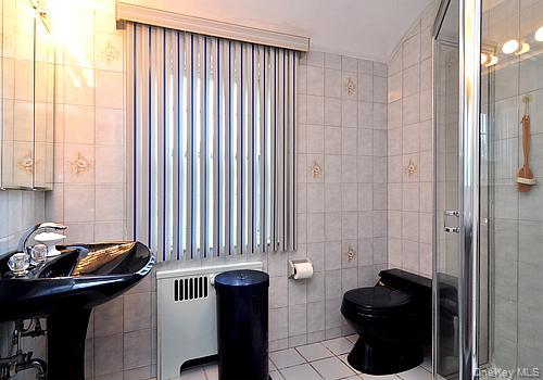 171 East Rockaway Road Hewlett, NY 11557 - Photo 9 of 13 a bathroom with a sink and a mirror