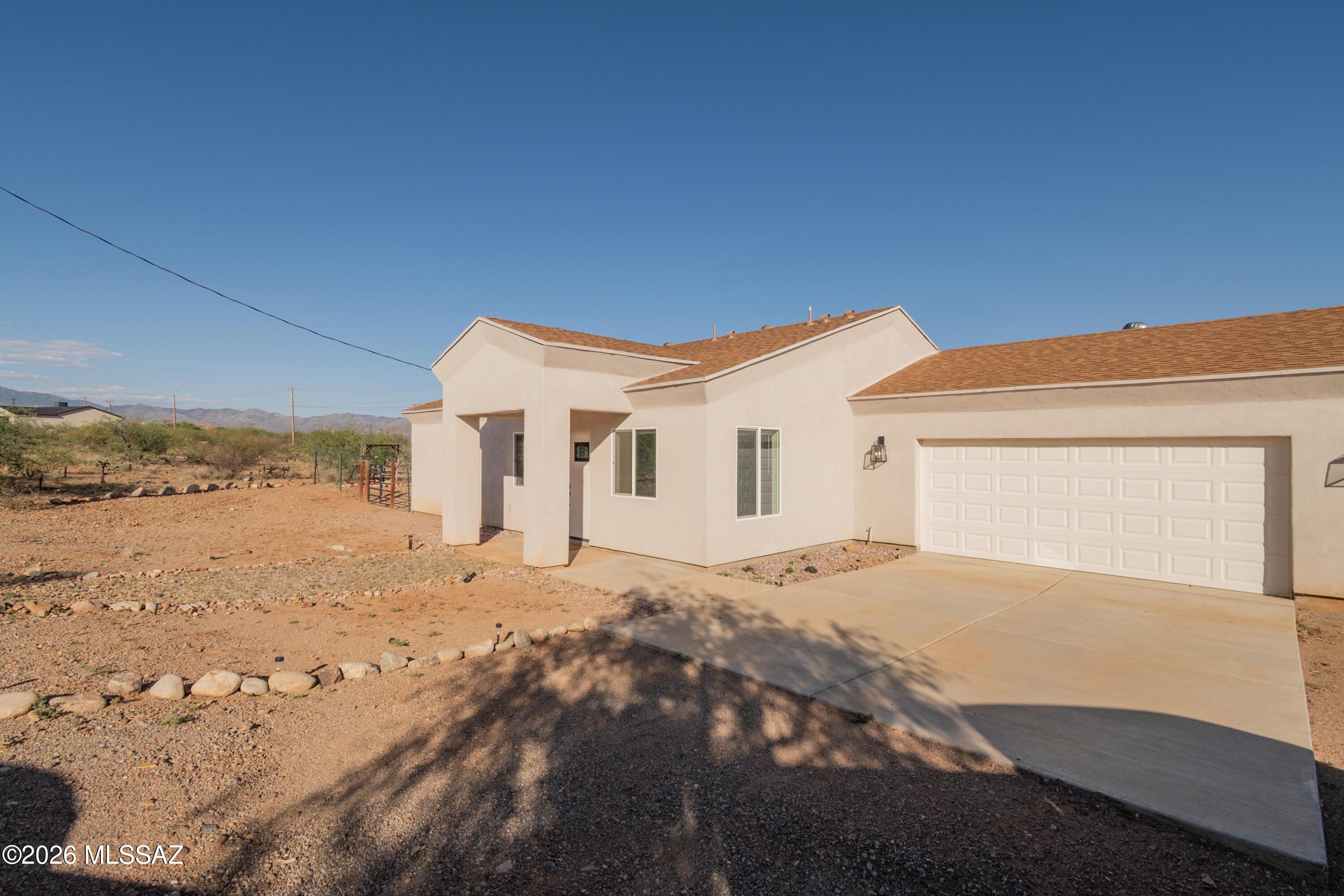 1785 Dove Court Rio Rico, AZ 85648 - Photo 3 of 31 a view of a house with a snow in the background