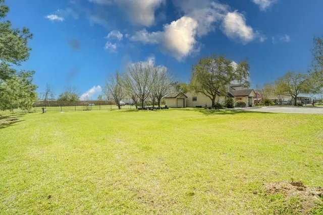 a room with gym equipment and a chandelier