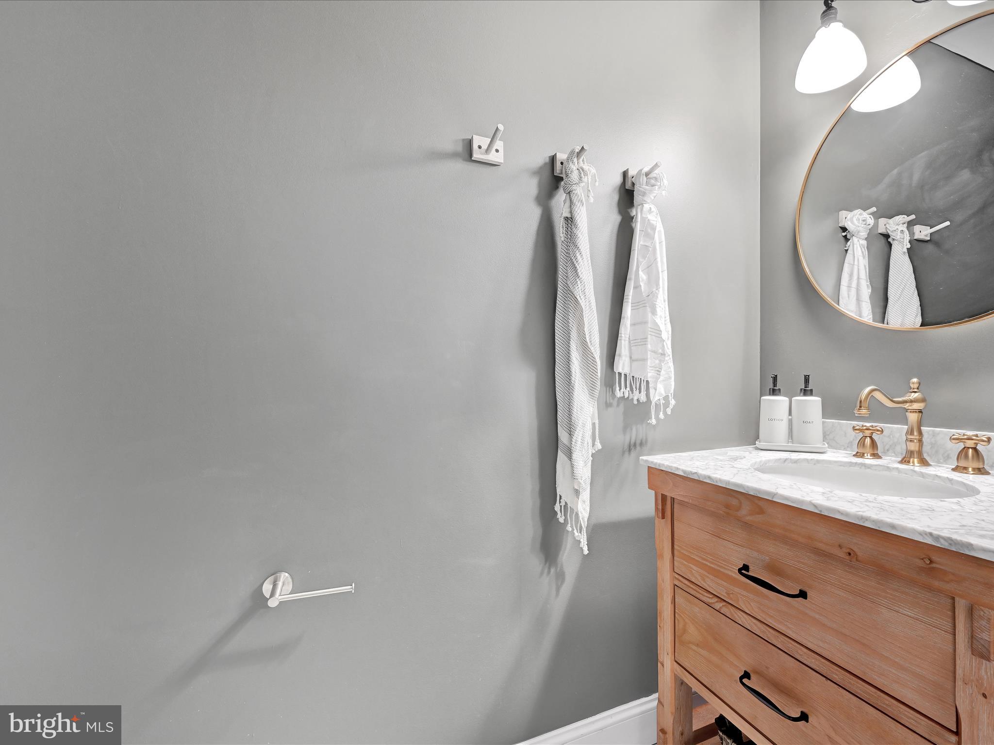 4018 Hillview Road Temple, PA 19560 - Photo 21 of 52 a bathroom with a sink vanity and a mirror