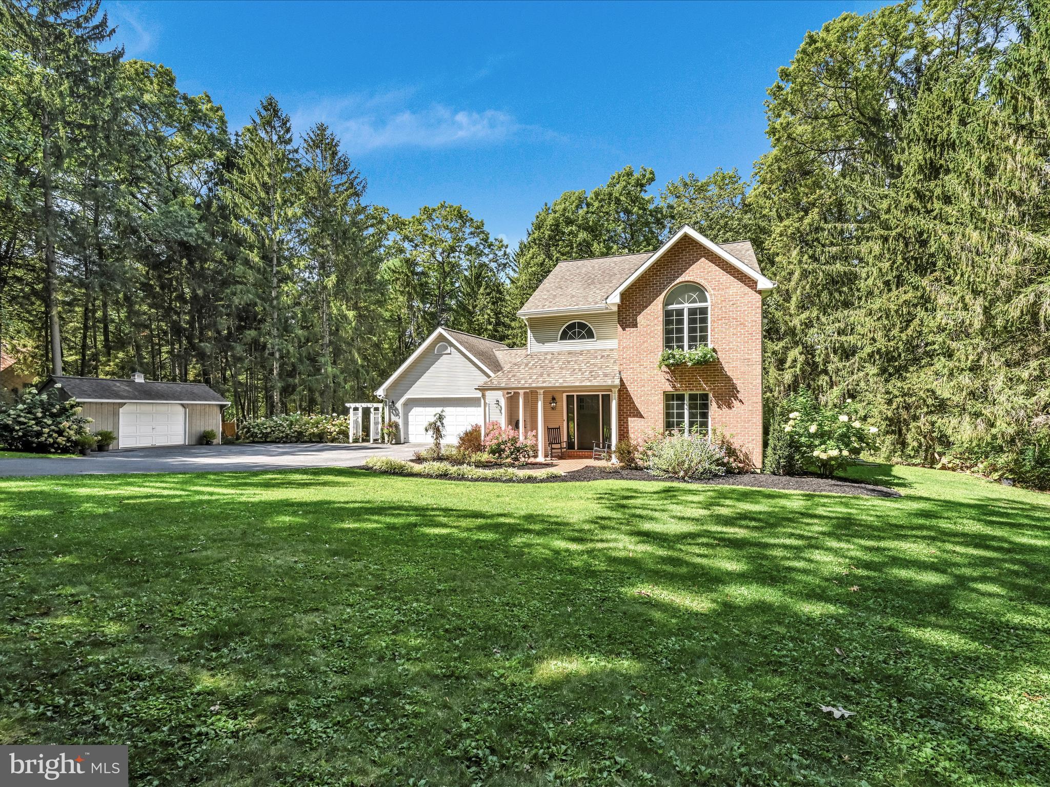 4018 Hillview Road Temple, PA 19560 - Photo 4 of 52 a front view of a house with a garden