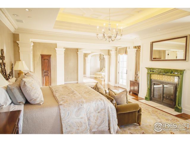 a living room with furniture a flat screen tv and a window