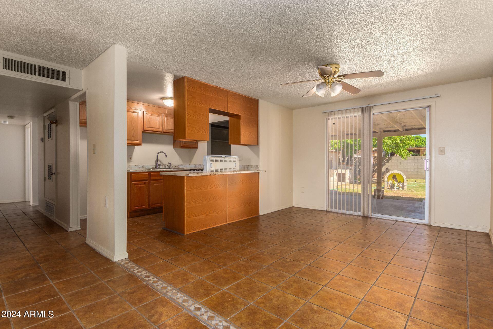 6020 West Granada Road Phoenix, AZ 85035 - Photo 3 of 18 18a Kitchen Din Hallway Granada