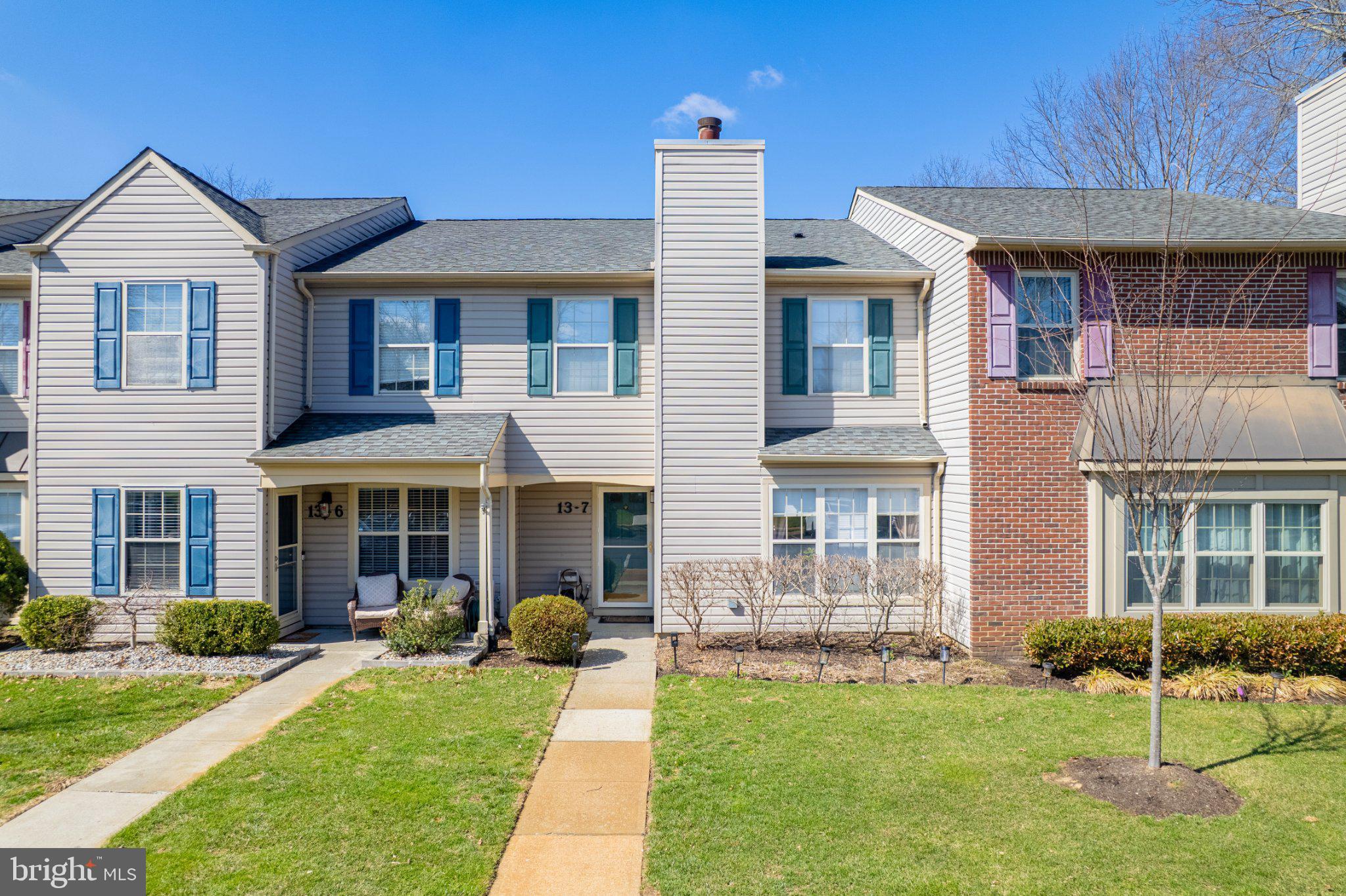 13-7 Stuart Drive Freehold, NJ 07728 - Photo 1 of 27 a front view of a house with a yard