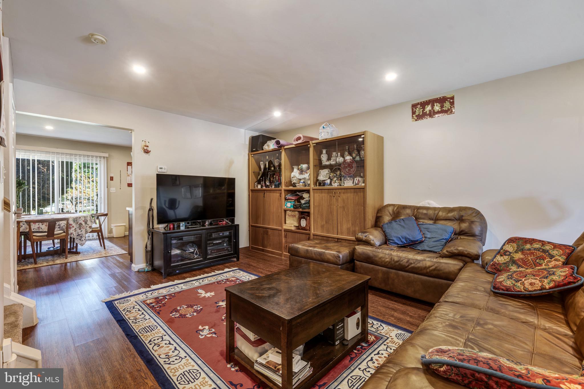 13-7 Stuart Drive Freehold, NJ 07728 - Photo 12 of 27 a living room with furniture and a flat screen tv