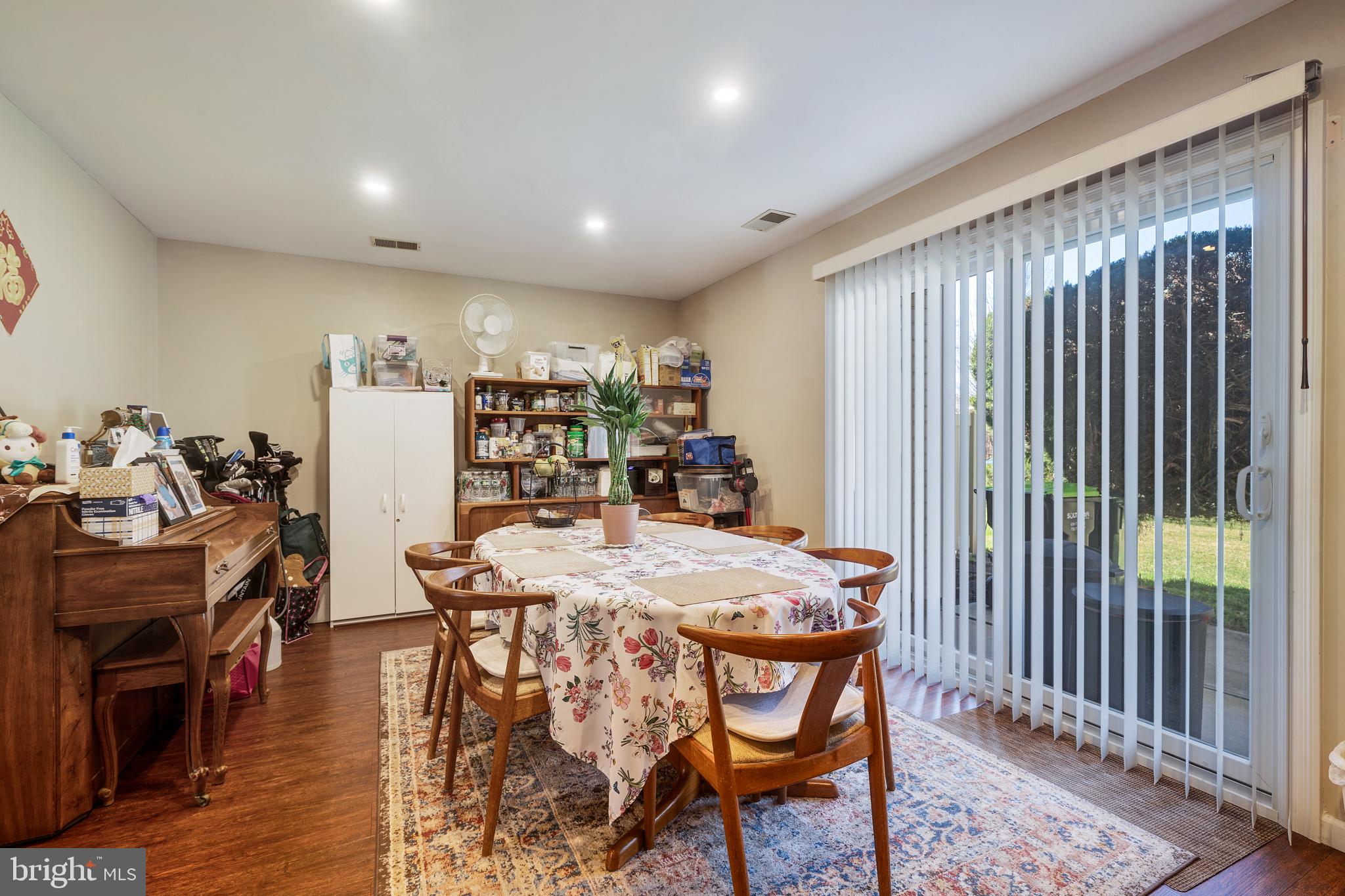 13-7 Stuart Drive Freehold, NJ 07728 - Photo 14 of 27 a dining room with furniture and wooden floor