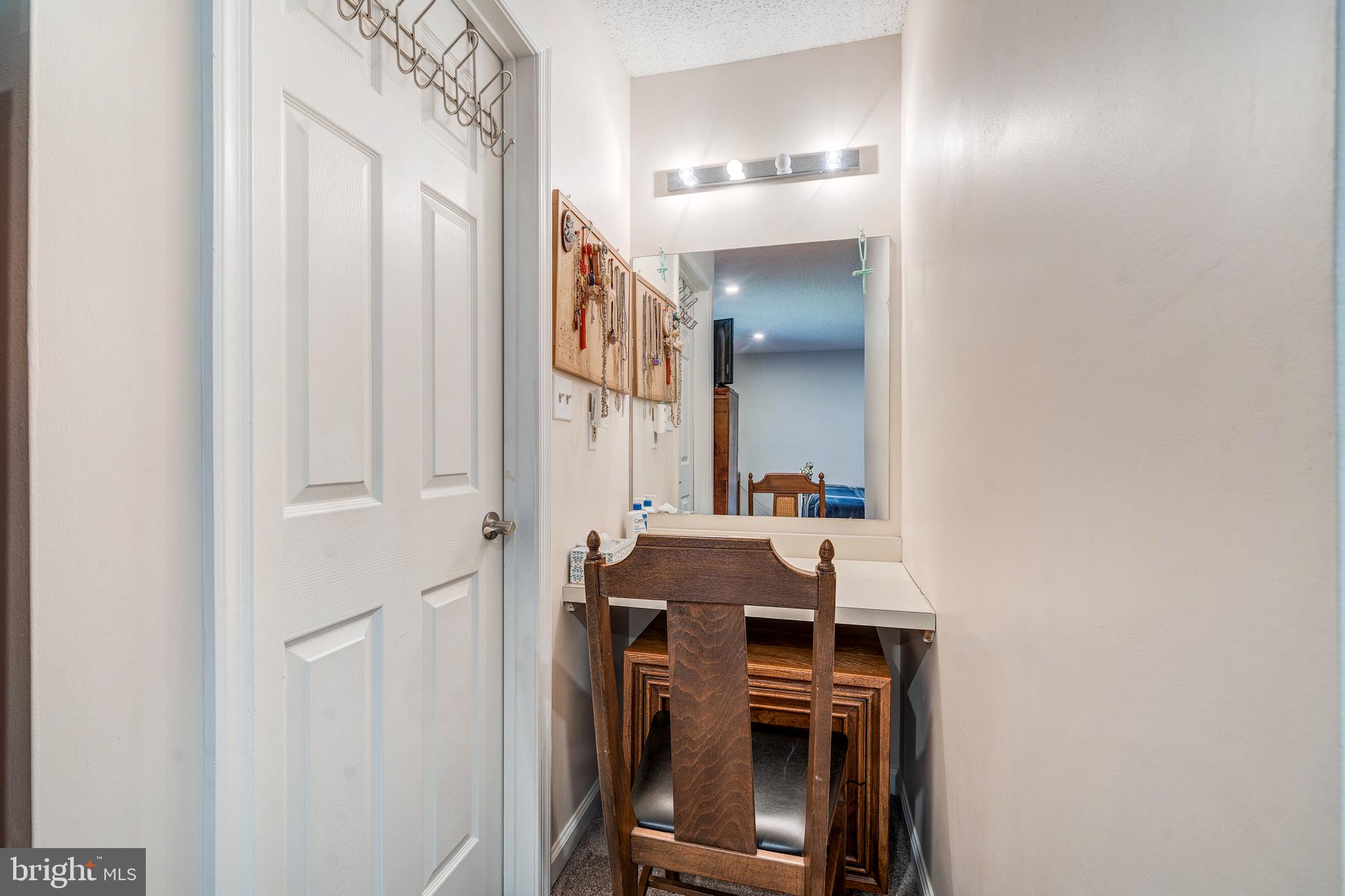 13-7 Stuart Drive Freehold, NJ 07728 - Photo 20 of 27 a view of a hallway with workspace