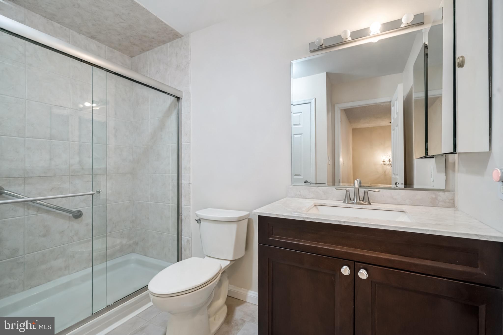 13-7 Stuart Drive Freehold, NJ 07728 - Photo 21 of 27 a bathroom with a sink toilet and shower