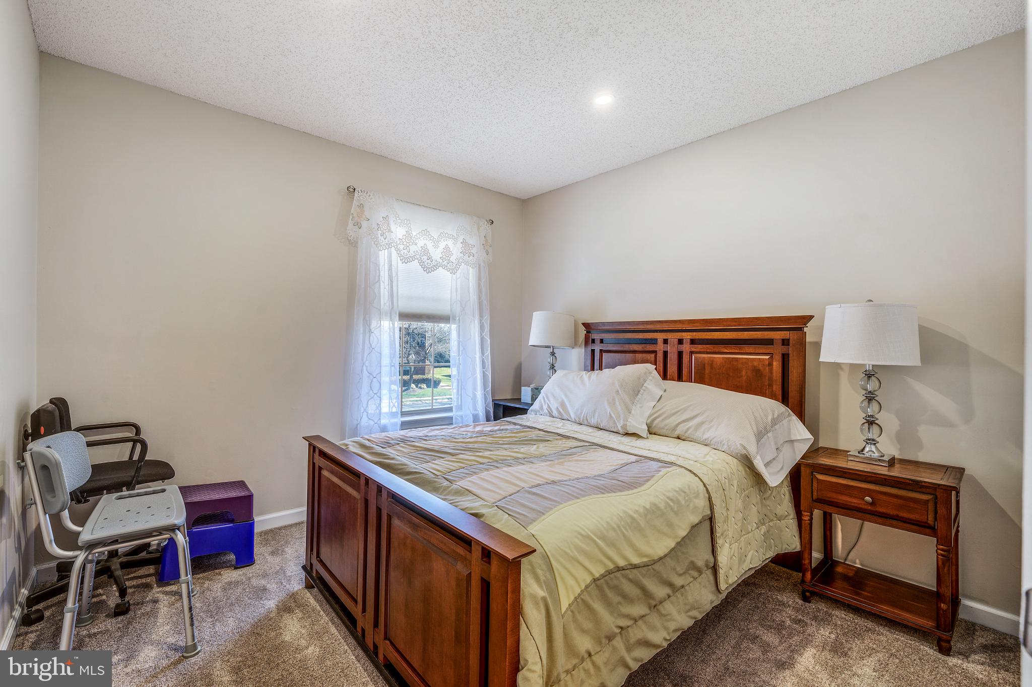 13-7 Stuart Drive Freehold, NJ 07728 - Photo 22 of 27 a bedroom with a bed and a window