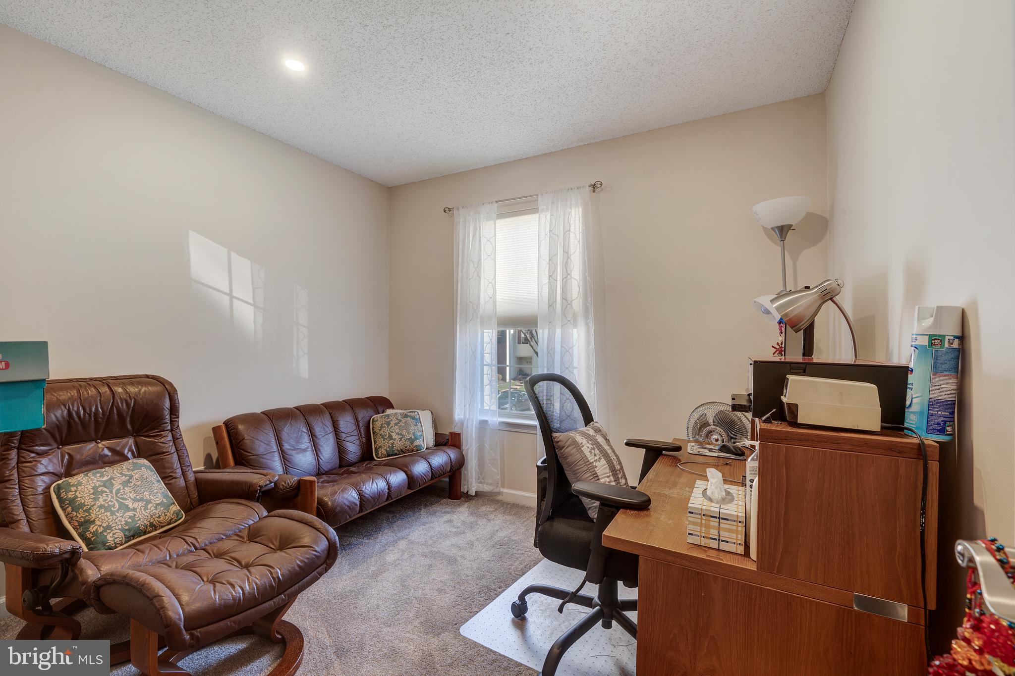 13-7 Stuart Drive Freehold, NJ 07728 - Photo 24 of 27 a living room with furniture and a window
