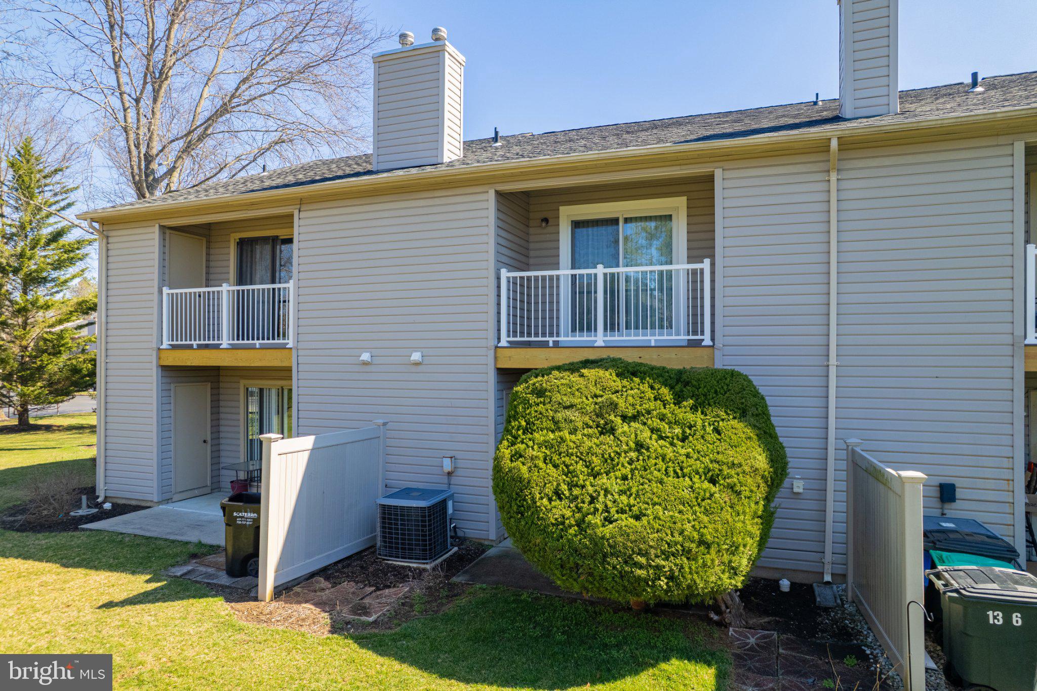 13-7 Stuart Drive Freehold, NJ 07728 - Photo 6 of 27 a front view of a house with garden