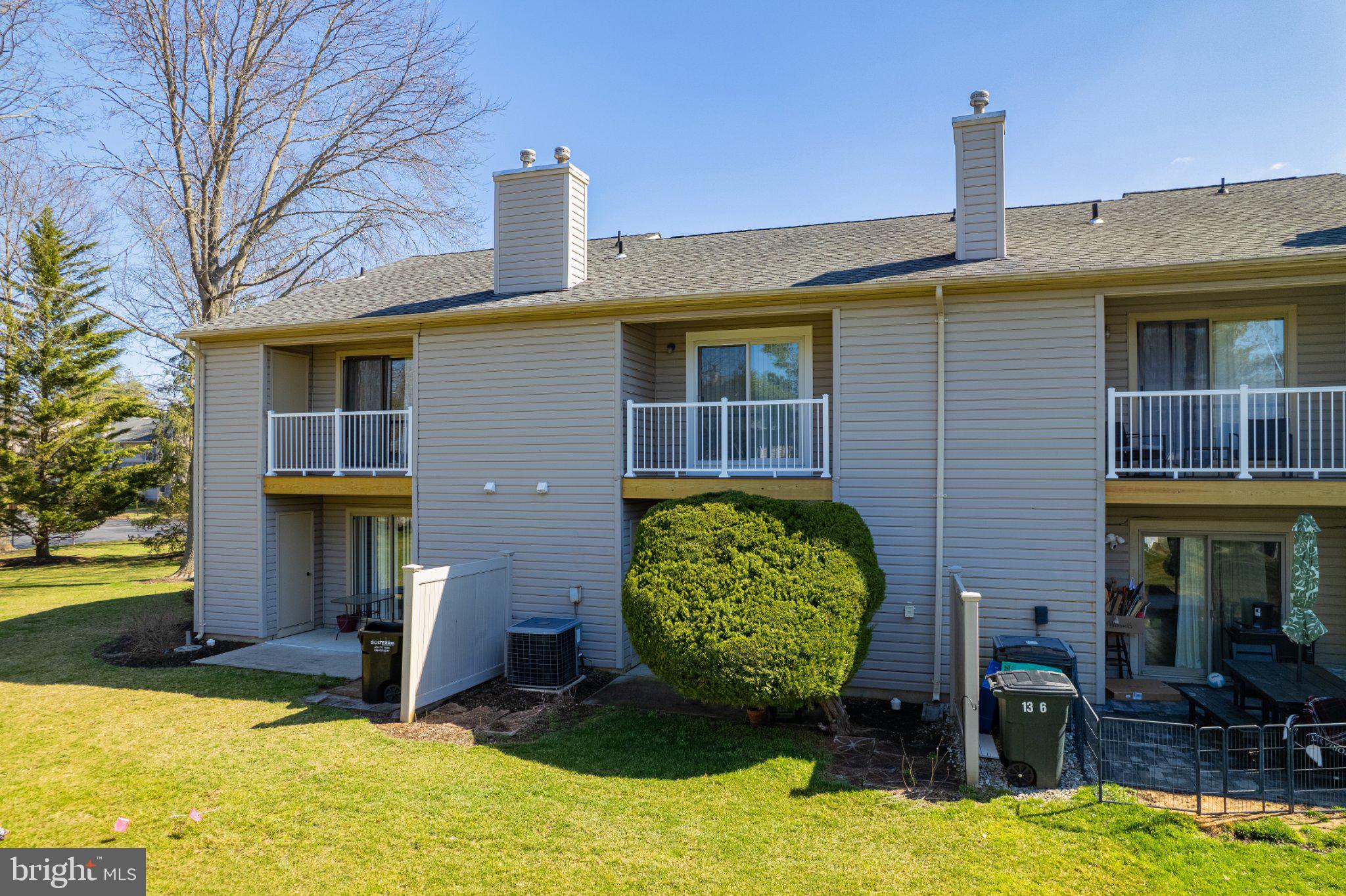 13-7 Stuart Drive Freehold, NJ 07728 - Photo 7 of 27 a front view of a house with a yard