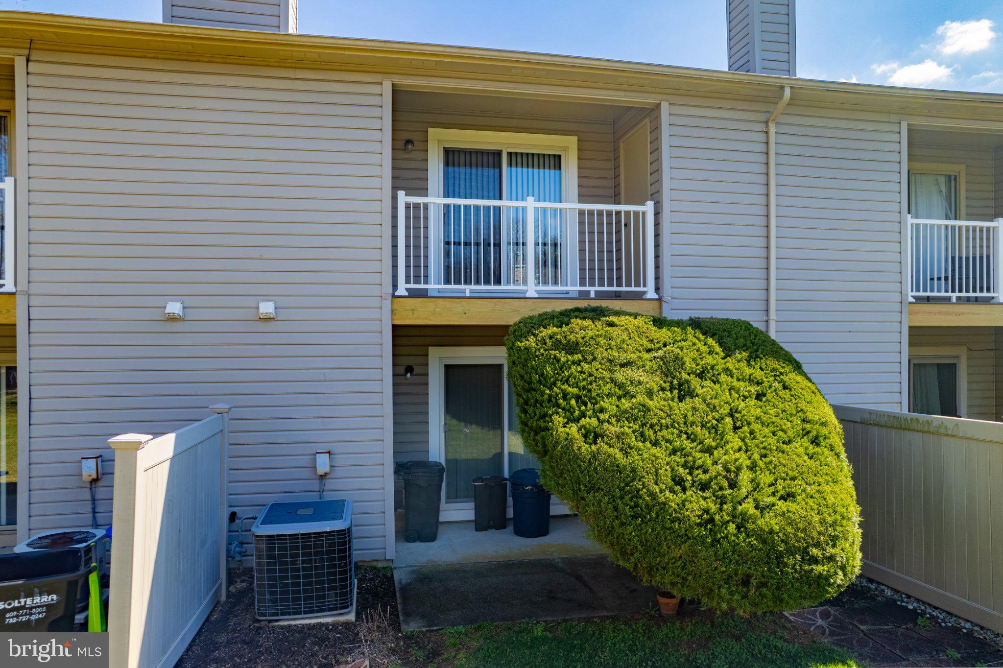 13-7 Stuart Drive Freehold, NJ 07728 - Photo 9 of 27 a view of a house with a backyard