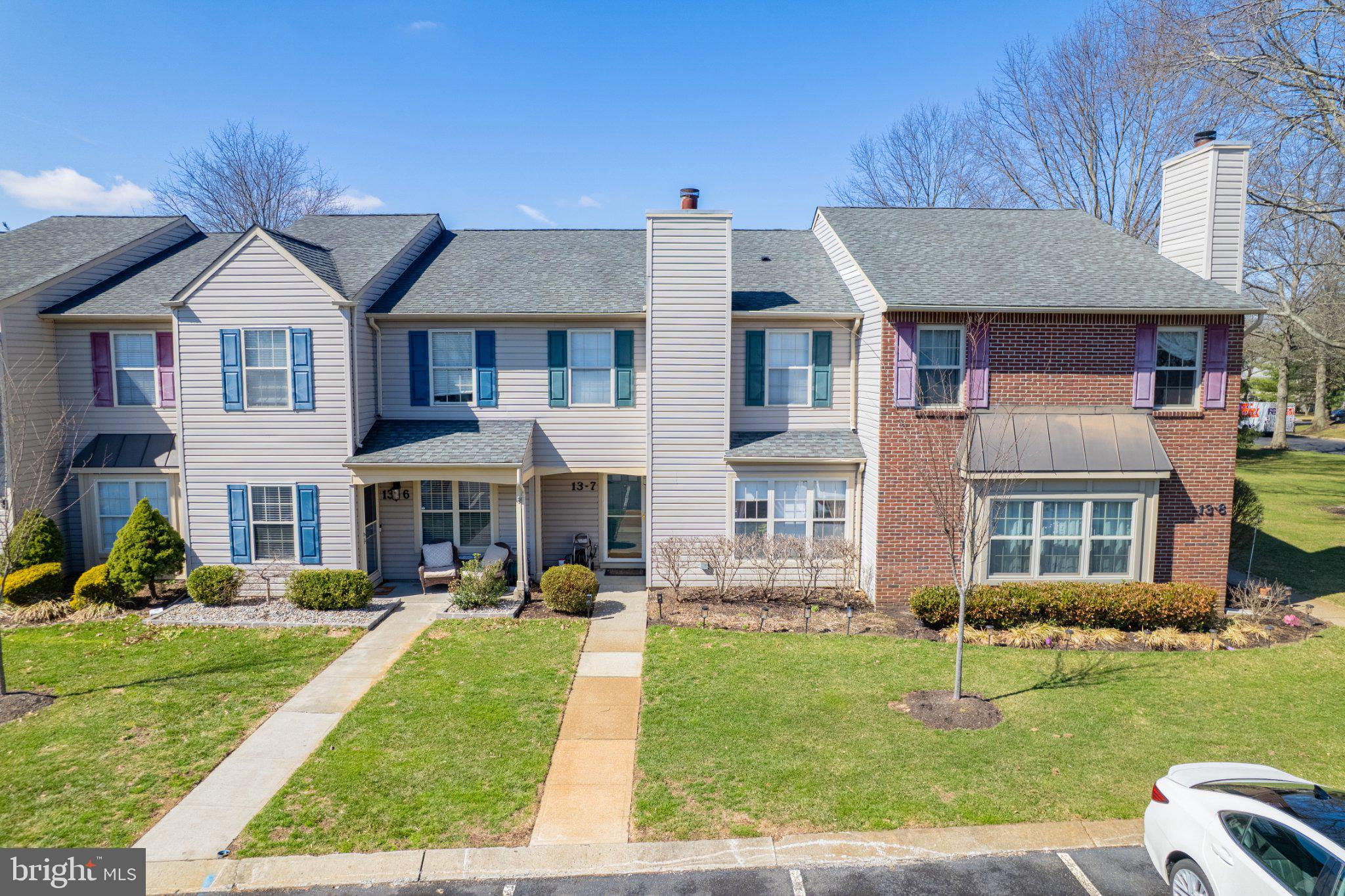 13-7 Stuart Drive Freehold, NJ 07728 - Photo 10 of 27 a front view of a house with a yard