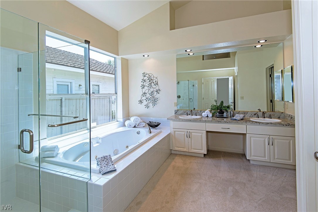6182 Squires Lane Reno, NV 89519 - Photo 11 of 17 a spacious bathroom with a tub sink shower and mirror