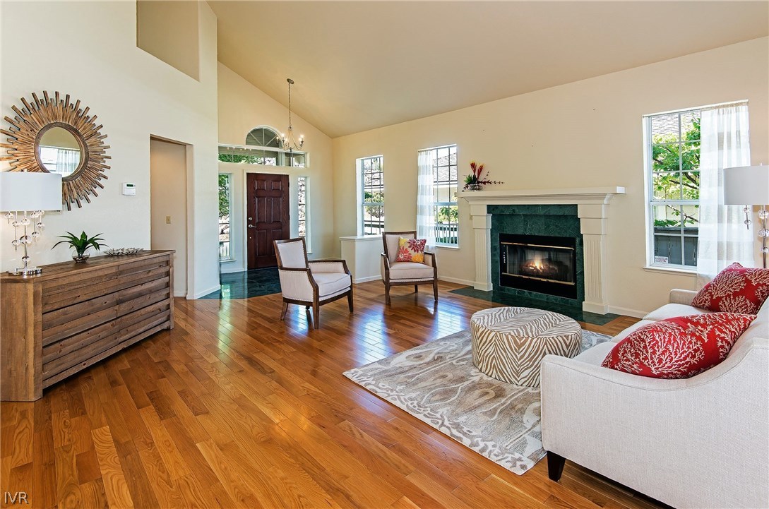 6182 Squires Lane Reno, NV 89519 - Photo 6 of 17 a living room with furniture and a fireplace