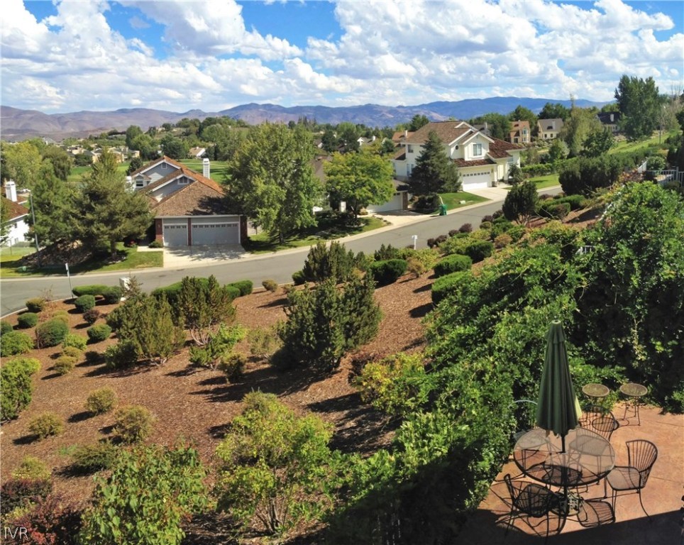 6182 Squires Lane Reno, NV 89519 - Photo 7 of 17 a view of a garden with a house