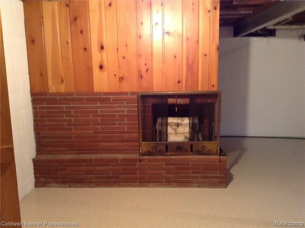 1047 Turrill Road Lapeer, MI 48446 - Photo 35 of 58 Fireplace in basement.