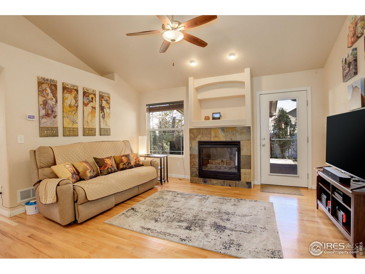 6848 McClellan Road Wellington, CO 80549 - Photo 2 of 15 Living Room with Gas Fireplace