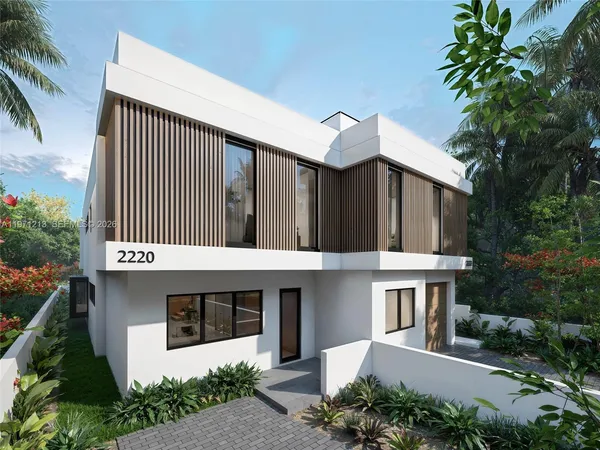 a front view of a house with a garage