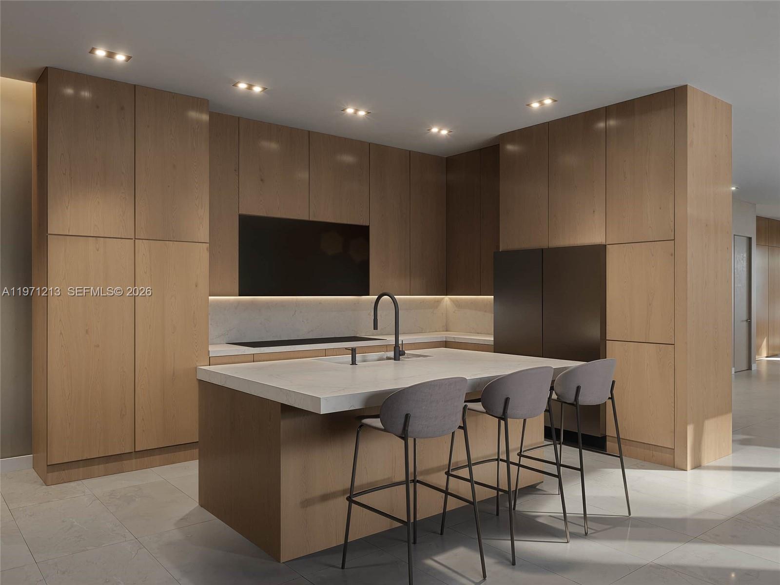 2220 Southwest 14th Street, Unit LEFT Miami, FL 33145 - Photo 3 of 17 a kitchen with stainless steel appliances kitchen island hardwood floor and chairs