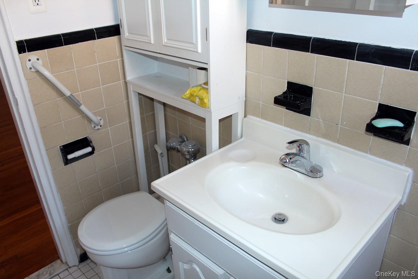 811 Bronx River Road, Unit 5A Yonkers, NY 10708 - Photo 12 of 18 Bathroom featuring tile walls and vanity