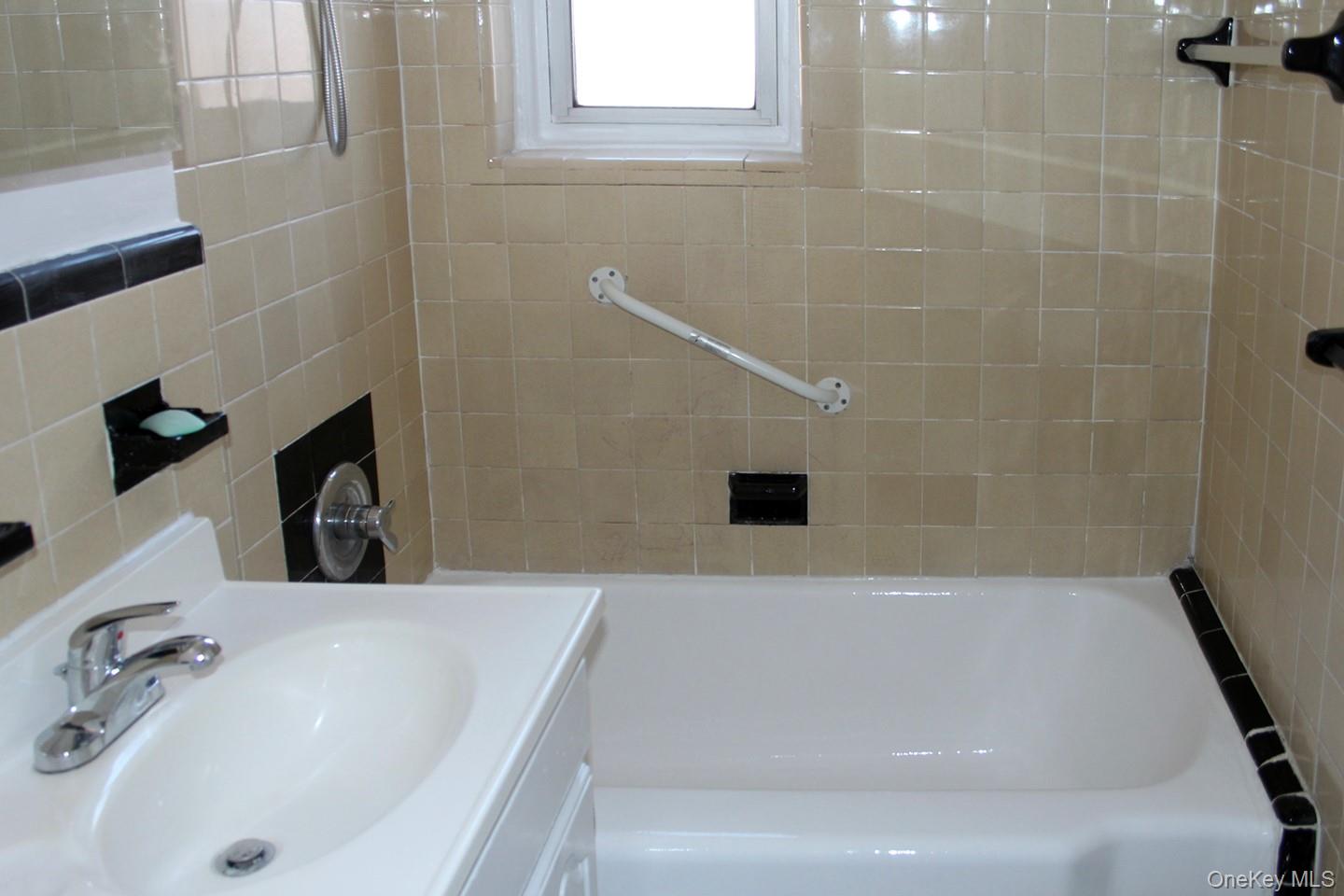 811 Bronx River Road, Unit 5A Yonkers, NY 10708 - Photo 13 of 18 Bathroom featuring vanity and shower / tub combination
