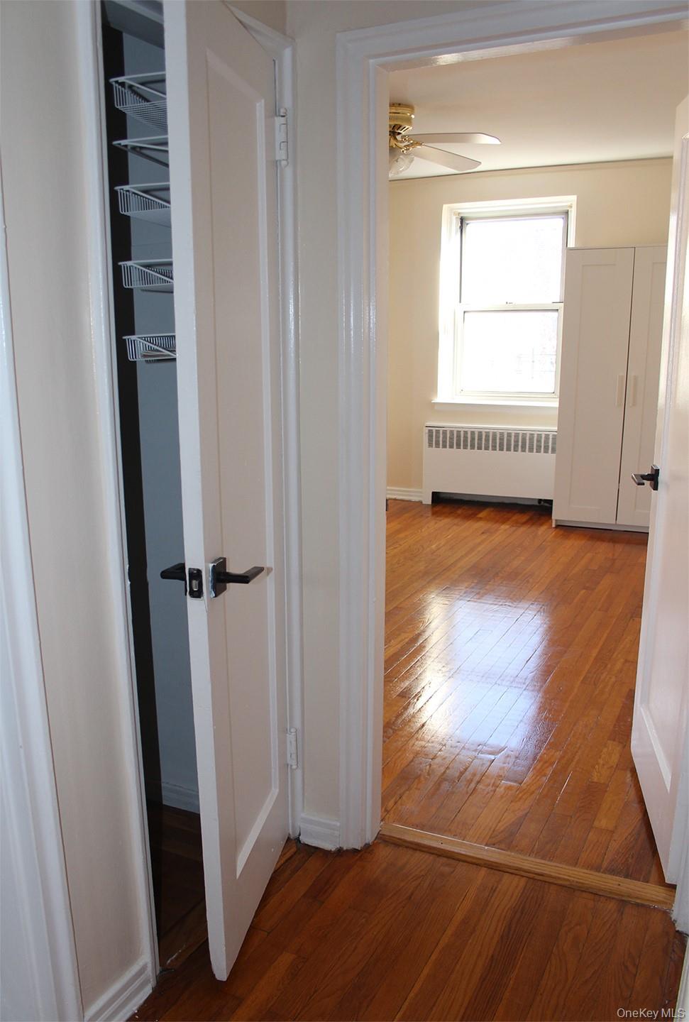 811 Bronx River Road, Unit 5A Yonkers, NY 10708 - Photo 14 of 18 Hall featuring wood-type flooring and radiator