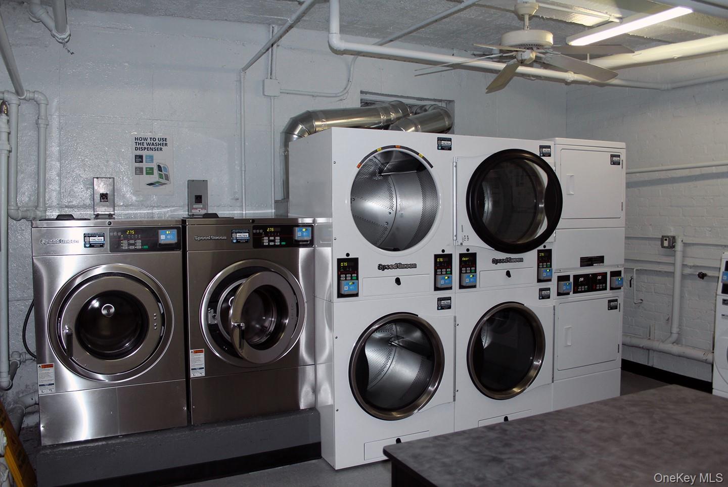 811 Bronx River Road, Unit 5A Yonkers, NY 10708 - Photo 17 of 18 Shared laundry room featuring stacked washer / dryer, ceiling fan, and washing machine and clothes dryer
