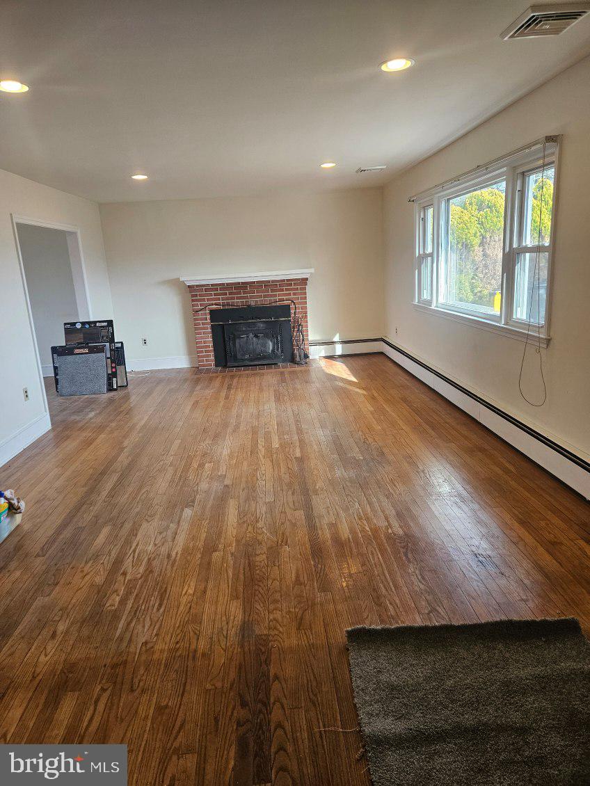 21 Manor Drive Dover, DE 19901 - Photo 12 of 24 a view of empty room with wooden floor and fan
