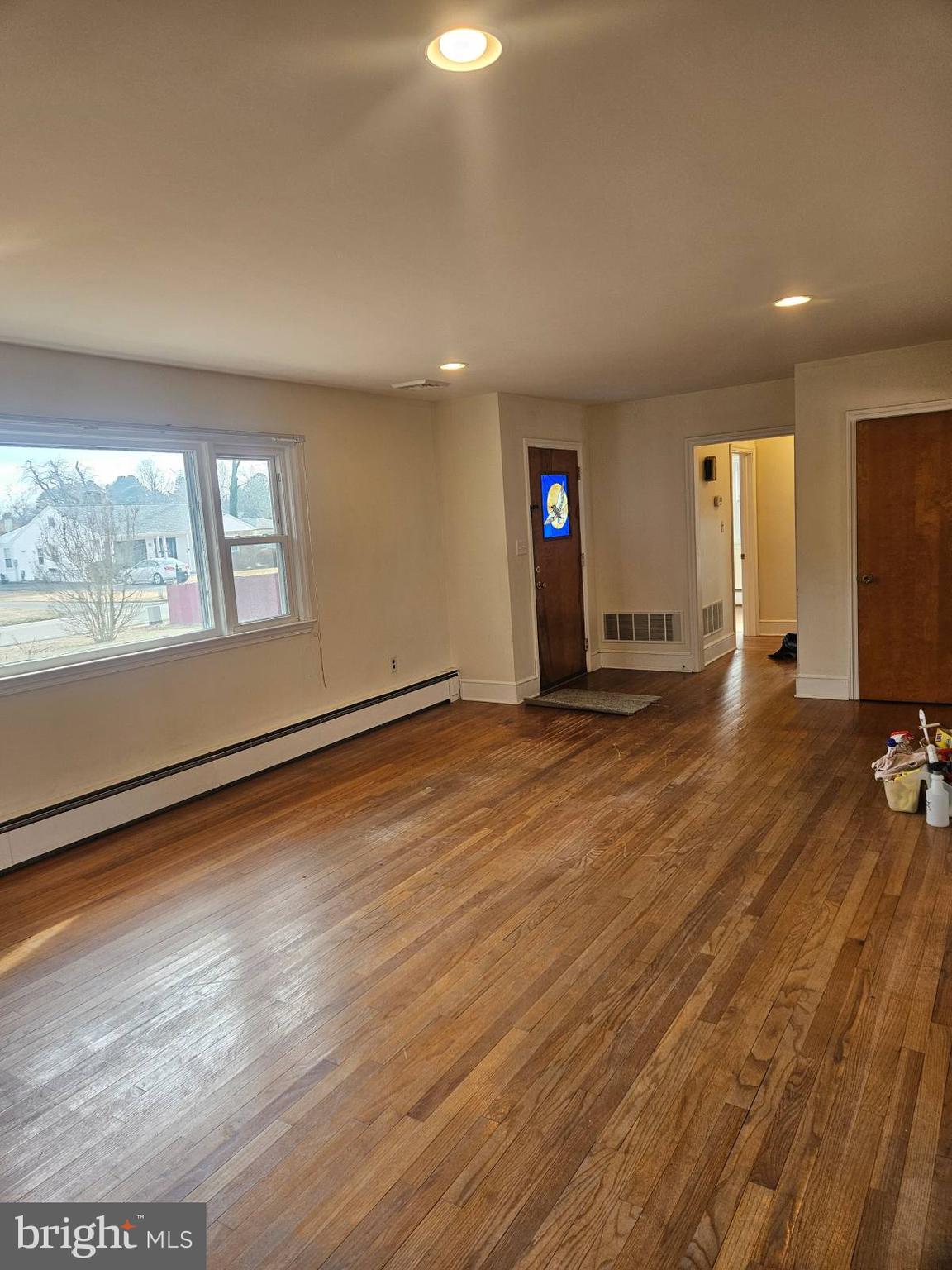 21 Manor Drive Dover, DE 19901 - Photo 15 of 24 an empty room with wooden floor and windows