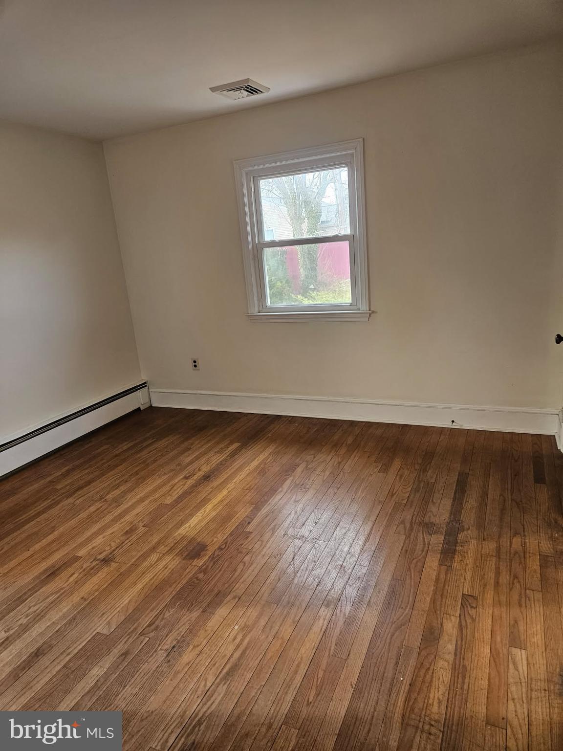 21 Manor Drive Dover, DE 19901 - Photo 20 of 24 an empty room with wooden floor and windows