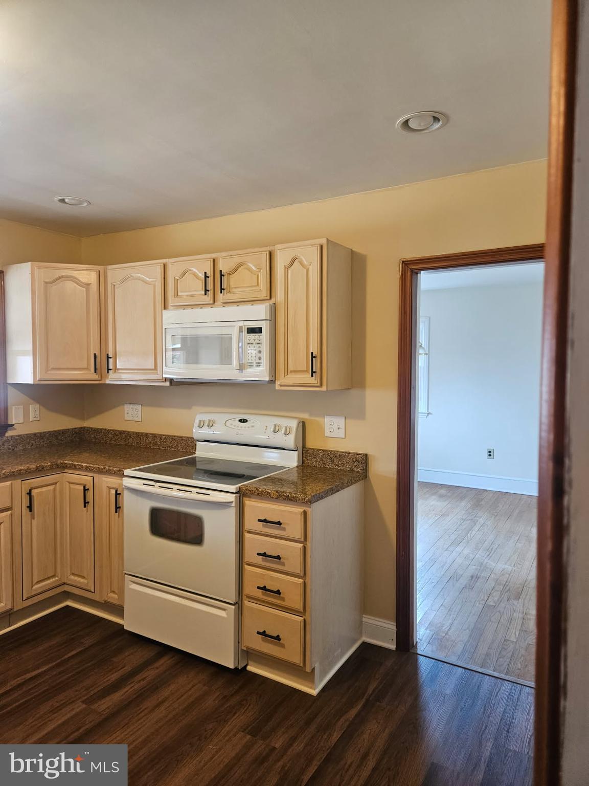 21 Manor Drive Dover, DE 19901 - Photo 5 of 24 a kitchen with granite countertop a stove and a sink