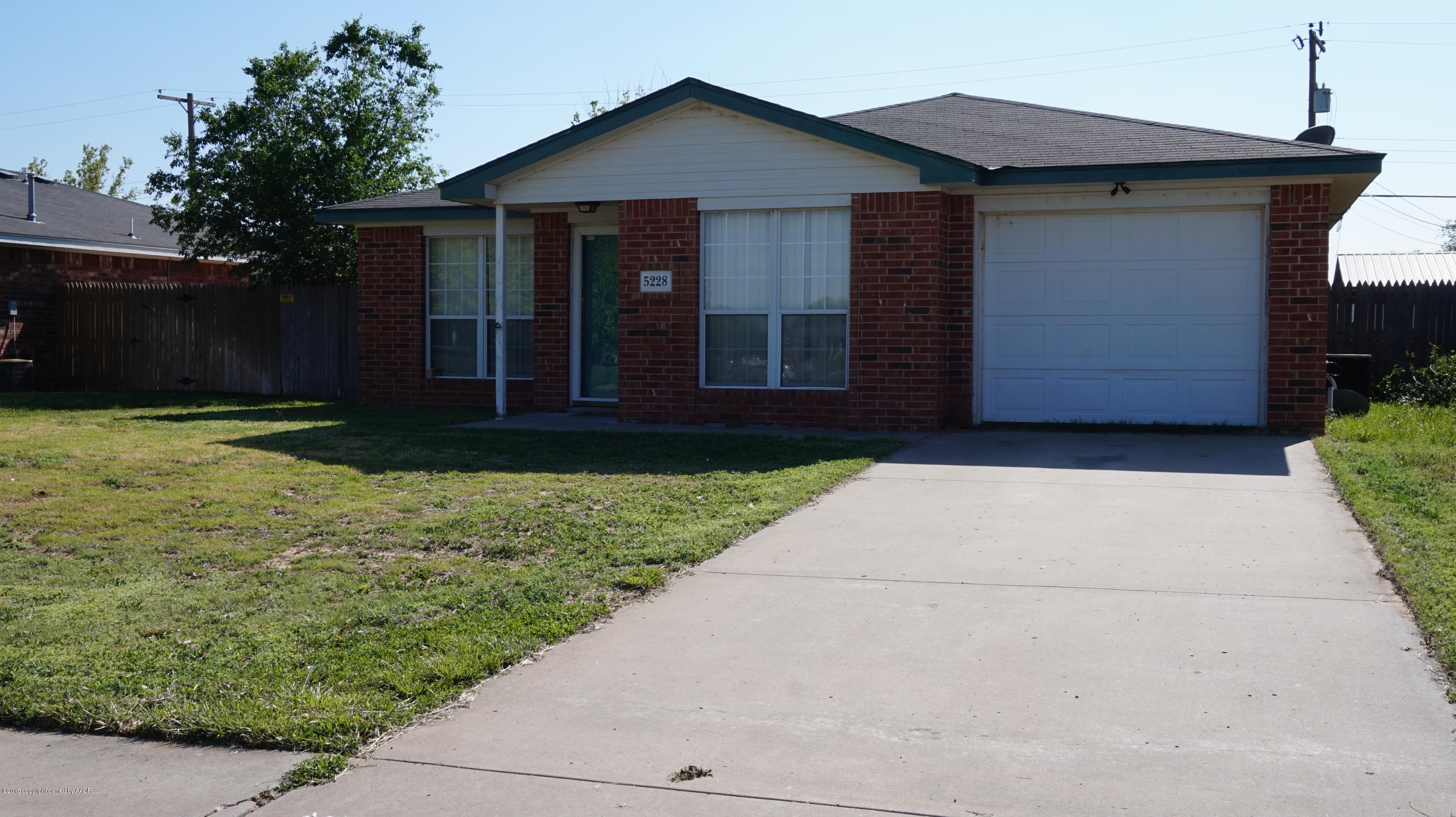 5228 Capulin Lane Amarillo, TX 79110 - Photo 1 of 16 a view of a house with a yard