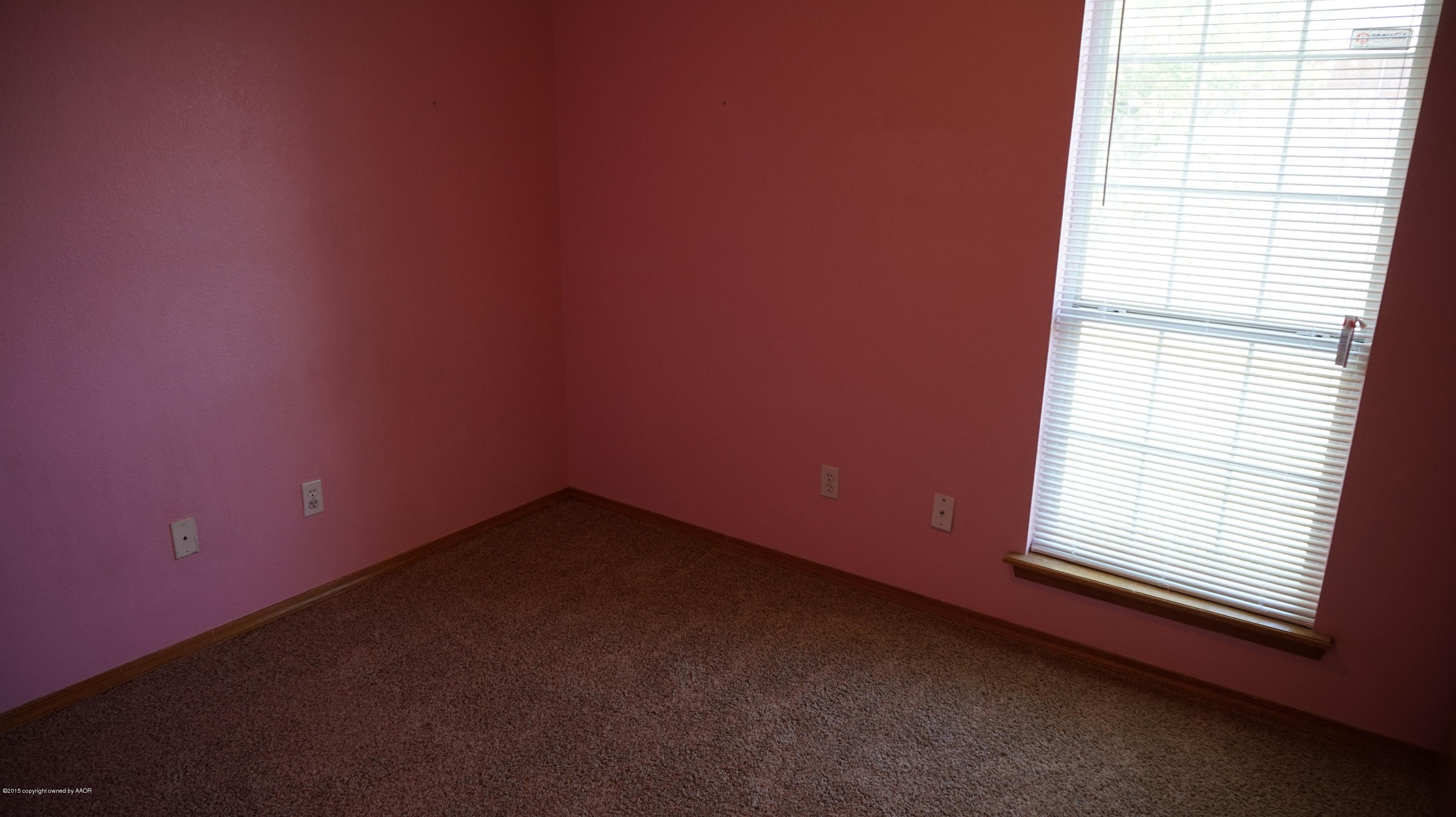 5228 Capulin Lane Amarillo, TX 79110 - Photo 15 of 16 a view of an empty room with a window