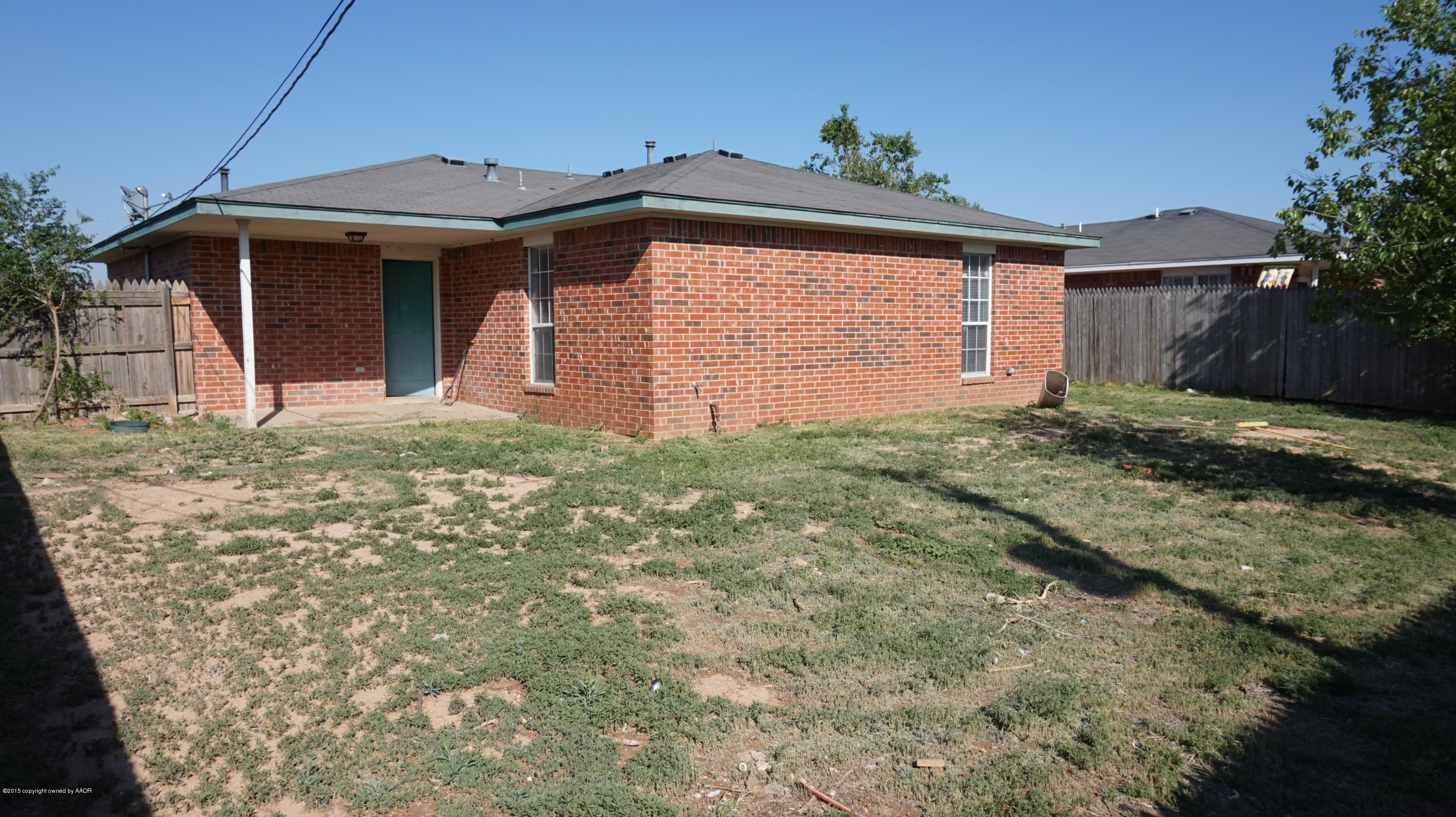 5228 Capulin Lane Amarillo, TX 79110 - Photo 16 of 16 a front view of a house with a yard