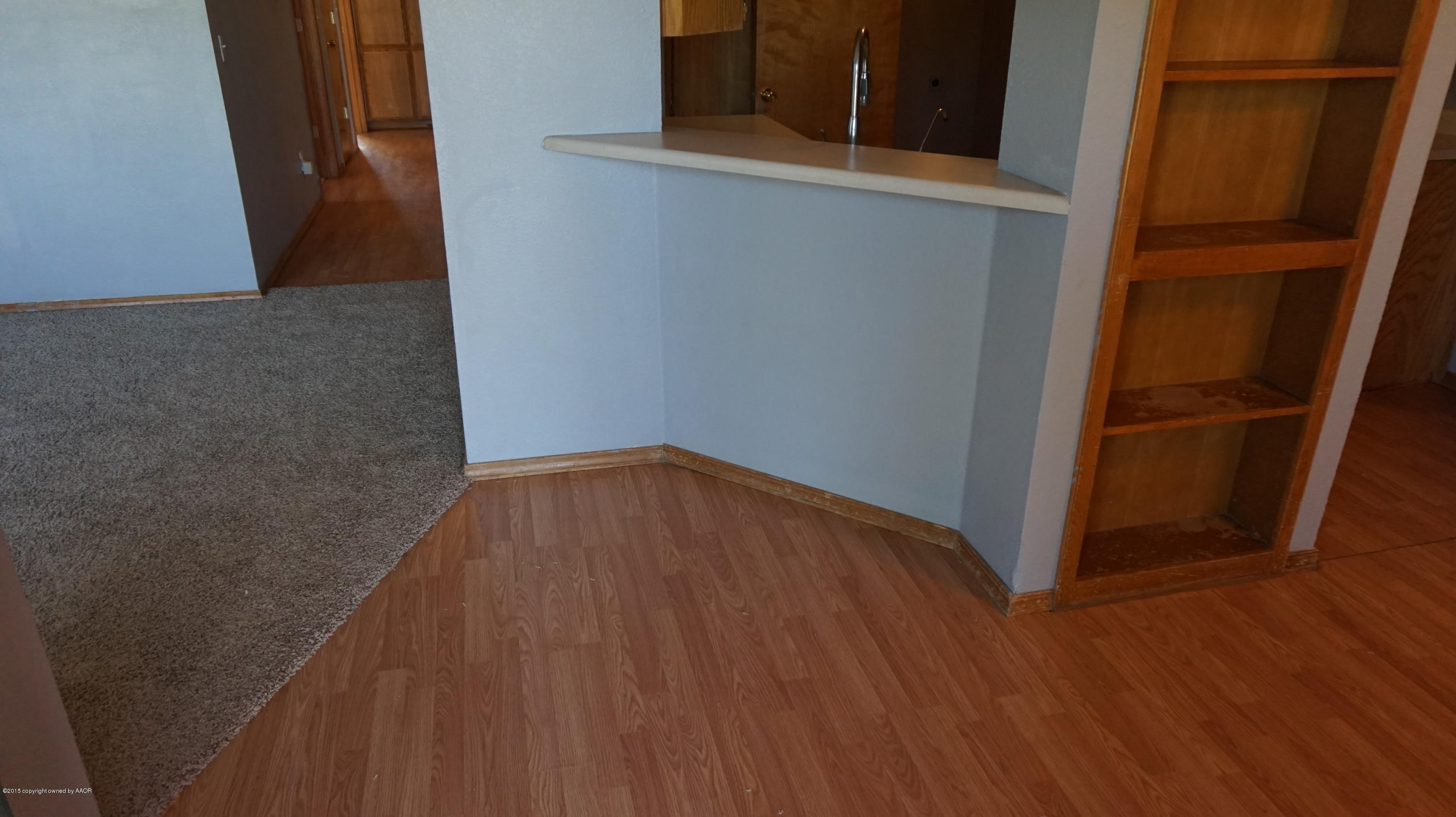 5228 Capulin Lane Amarillo, TX 79110 - Photo 3 of 16 a view of empty room with wooden floor