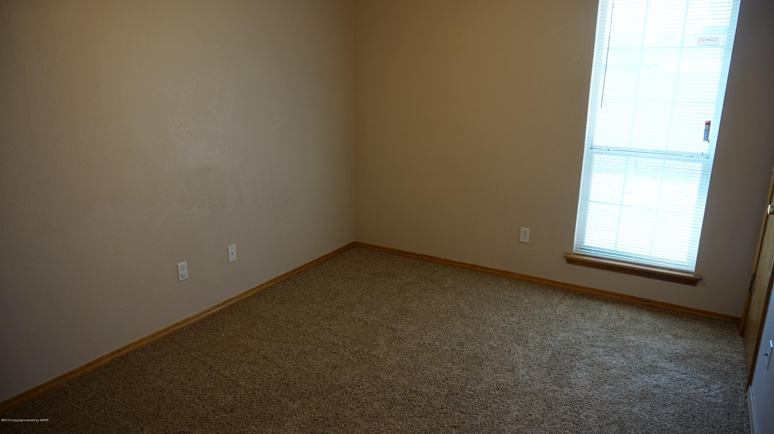 5228 Capulin Lane Amarillo, TX 79110 - Photo 10 of 16 an empty room with a window