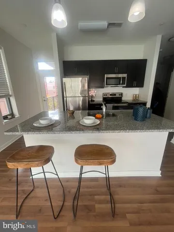 a white toilet sitting next to a white toilet