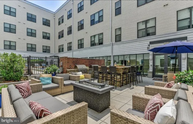 a view of a terrace with seating area
