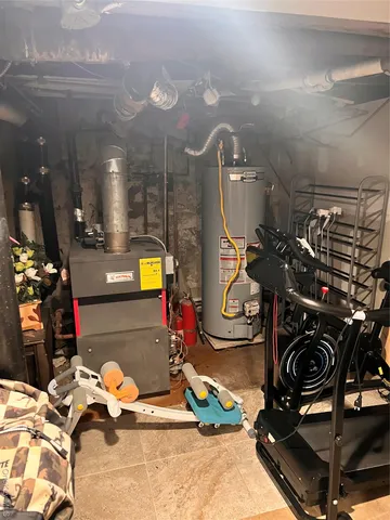 a bathroom with a glass door shower and a sink