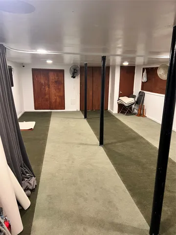 a white toilet sitting next to a sink