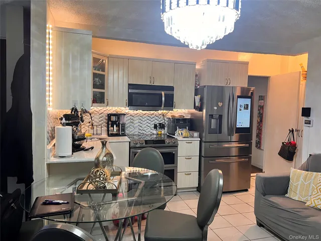 a living room with furniture dining table and a fireplace