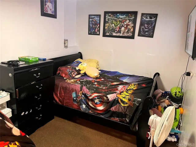 a white toilet sitting next to a bathroom sink and a shower